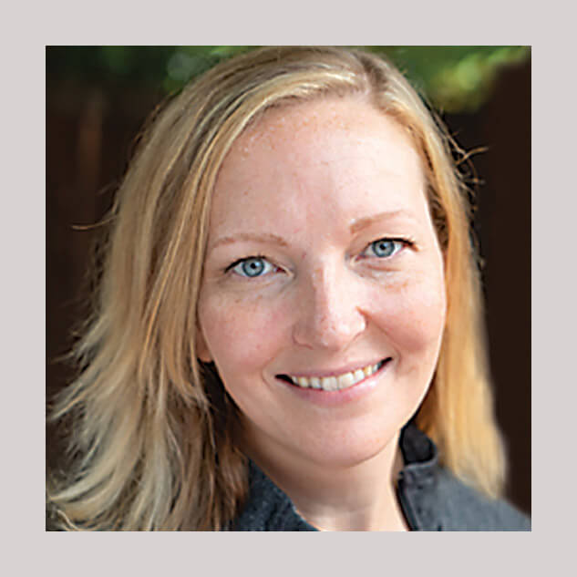 Dr. Katy Felton is a woman veterinarian, smiling for the camera.