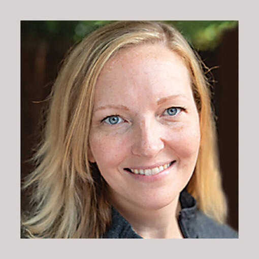 Dr. Katy Felton is a woman veterinarian, smiling for the camera.